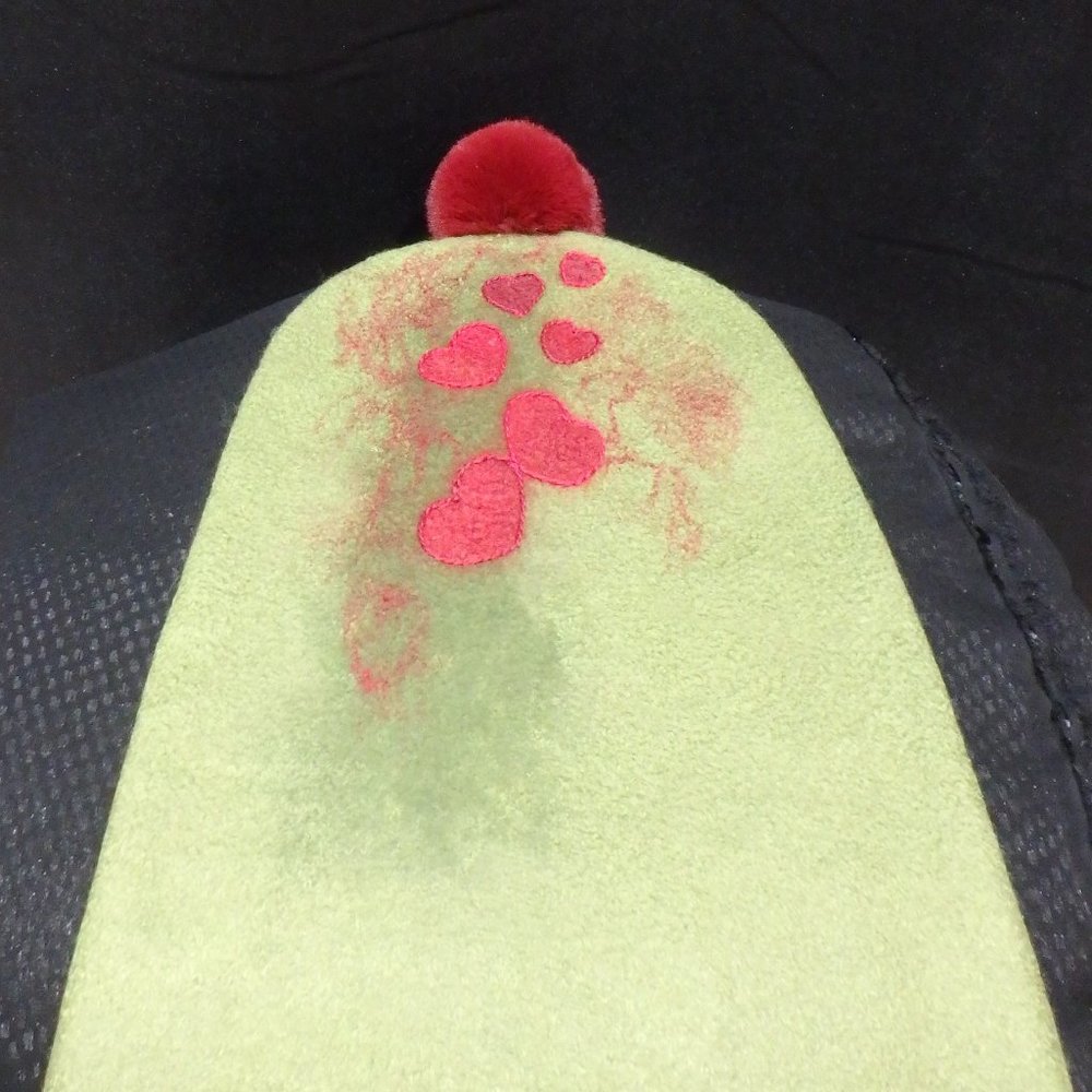 Hand-felted woolen hat with funny decoration